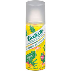 Batiste Tropical spray on roots for oil absorption and lift.