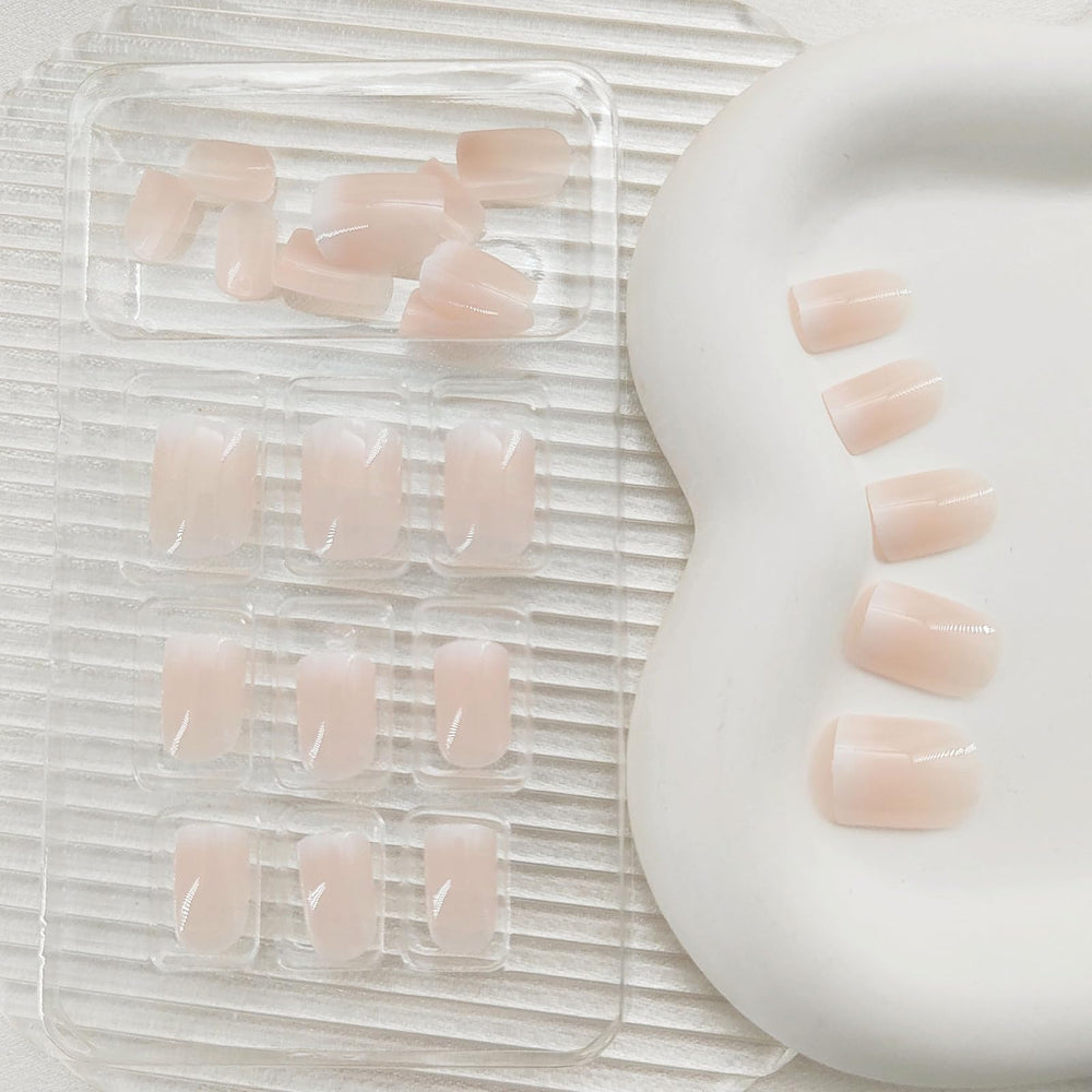 BDKAIWU glossy French-tip press-ons deliver a party-ready, stylish look.
