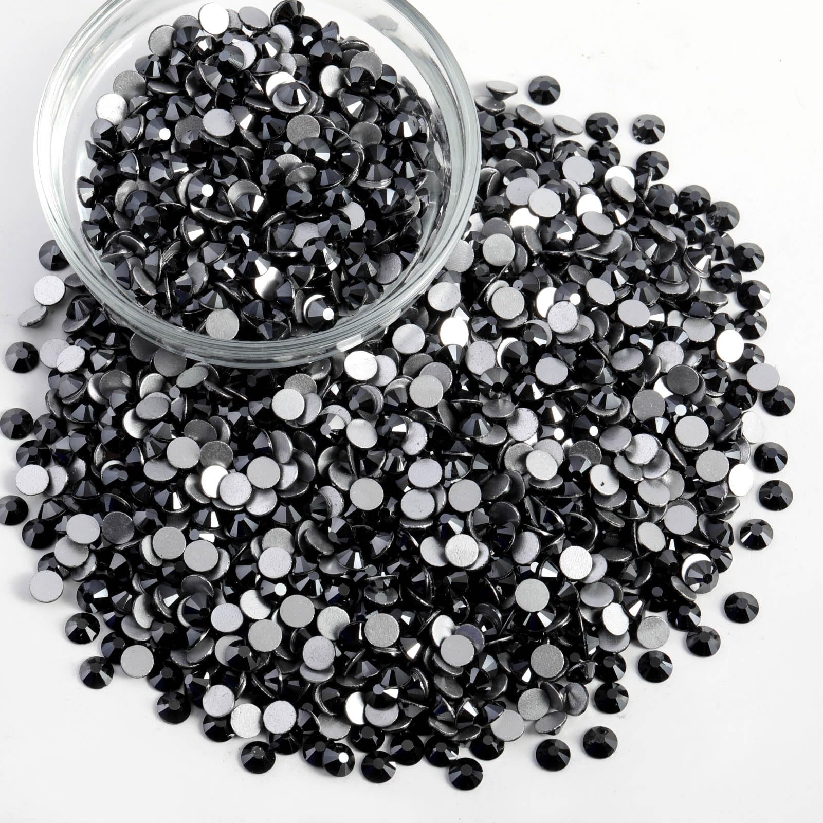 Beadsland rhinestones being applied with glue for easy DIY decoration.