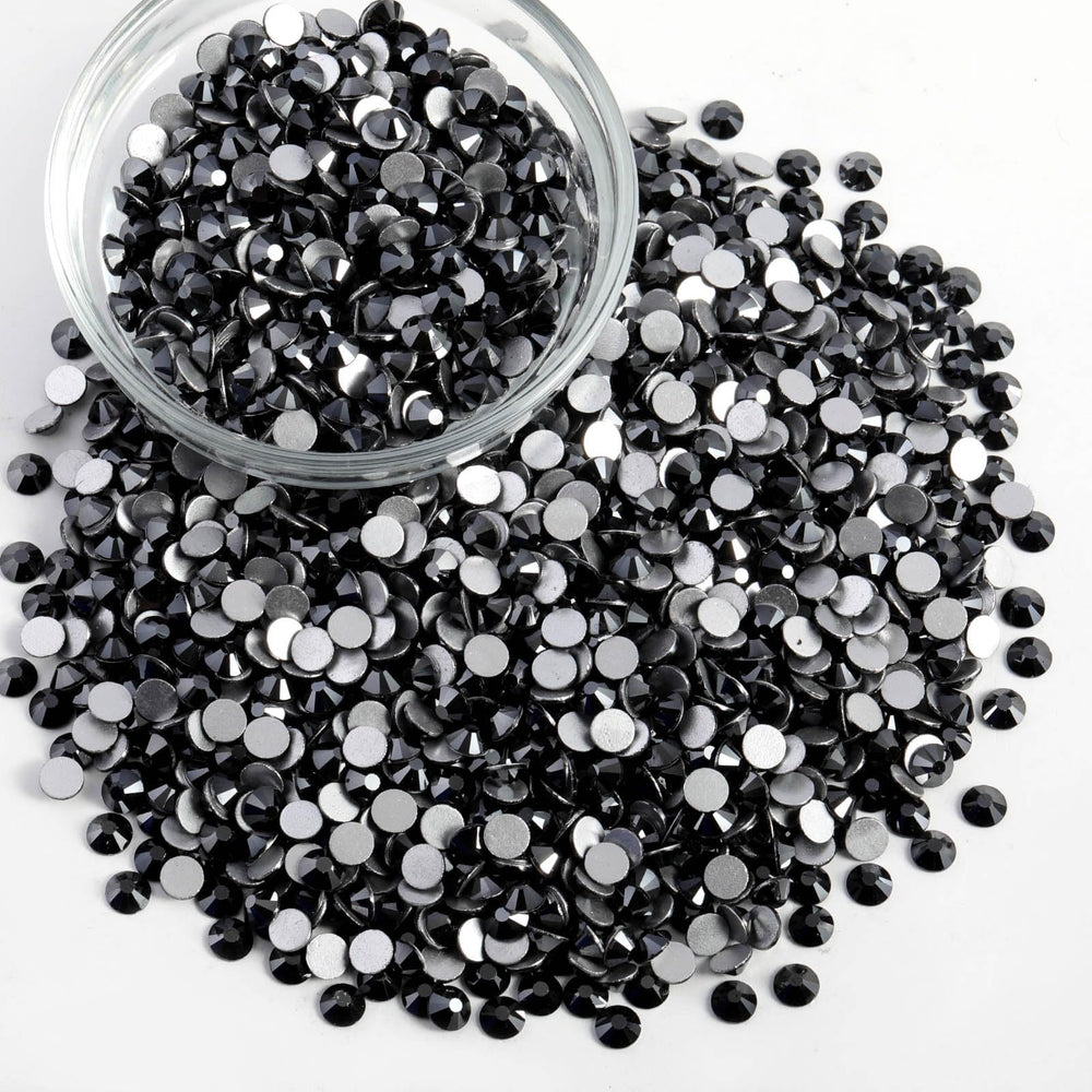 Beadsland rhinestones being applied with glue for easy DIY decoration.