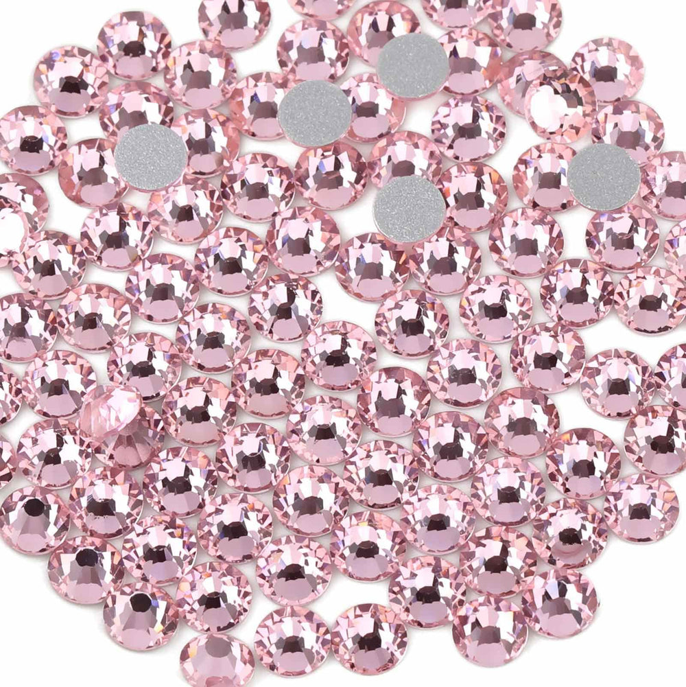 Beadsland light pink SS30 flatback rhinestones with precise cuts for elegant embellishments.