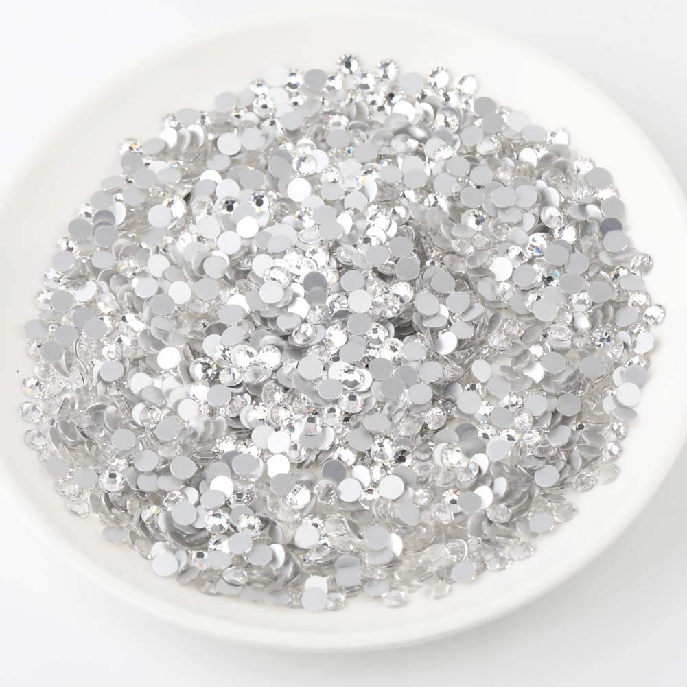Beadsland nail art rhinestones shown with glue application for durable decoration.
