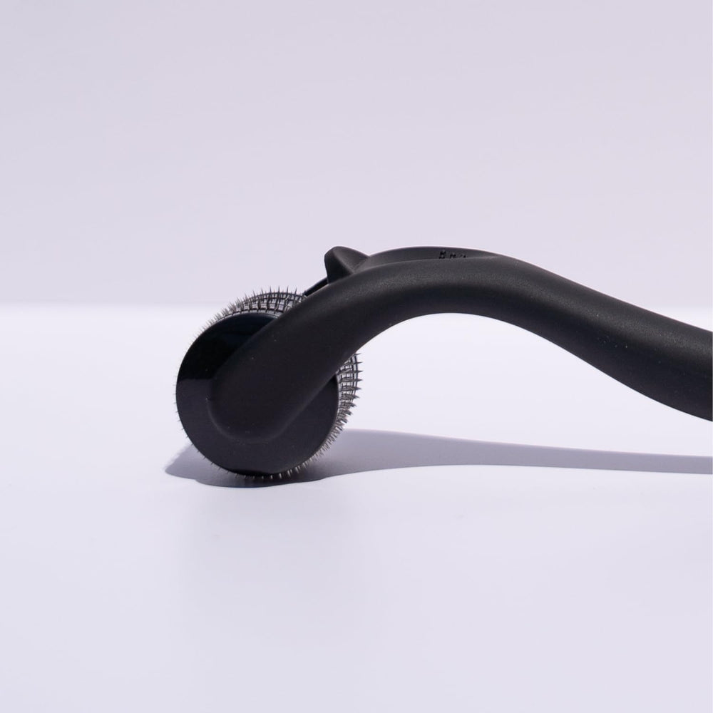 Beautimate microneedle derma roller on beard area for grooming.