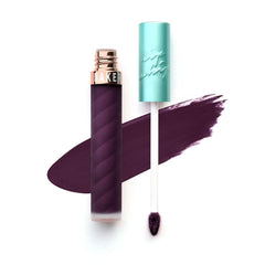 Beauty Bakerie Lip Whip She's Just Jelly close-up shows bold purple pigment and smooth texture.