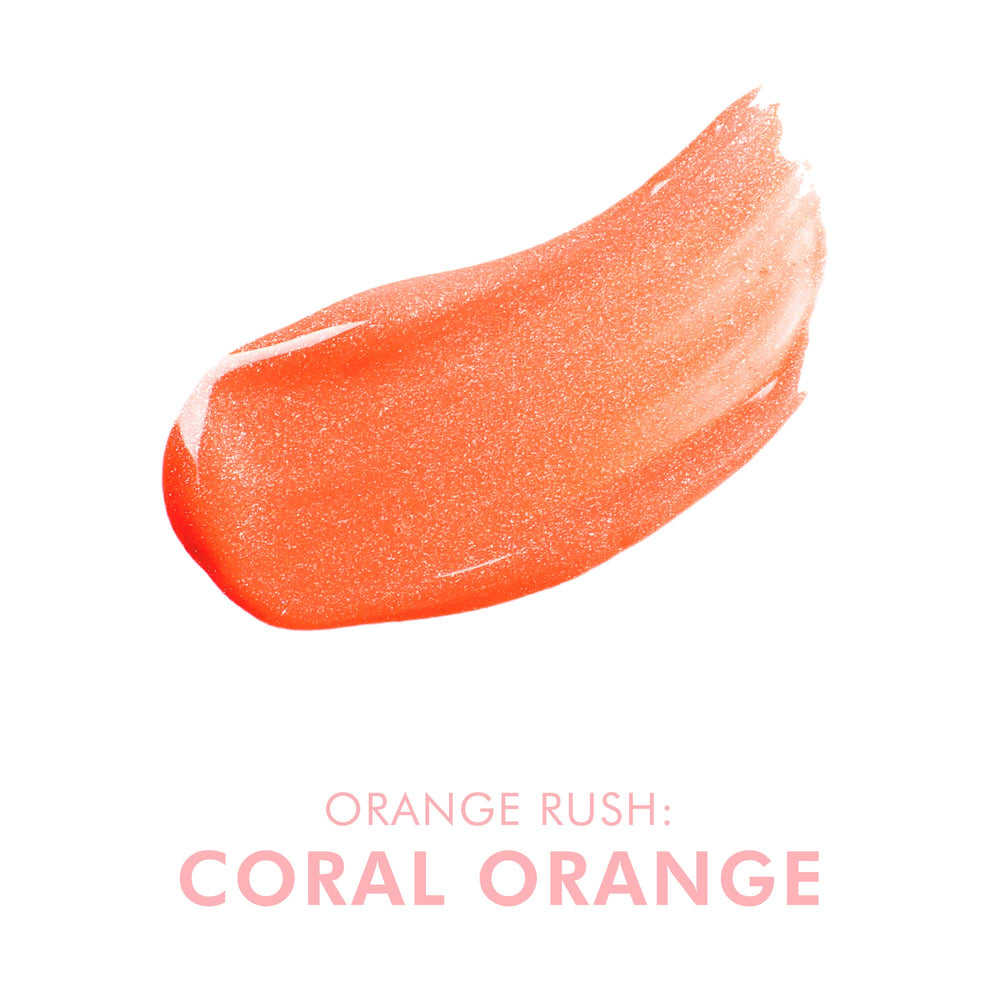 Beauty For Real Lip Gloss Shine Orange Rush swatch on lips shows bright coral color