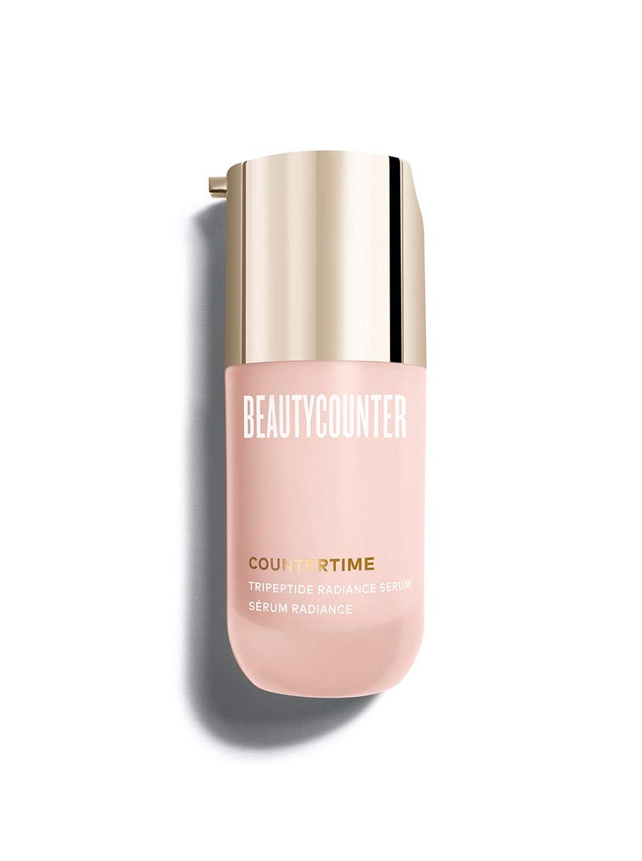 Beautycounter Countertime Tripeptide Radiance Serum bottle pour showing a hydrating, glow-ready application