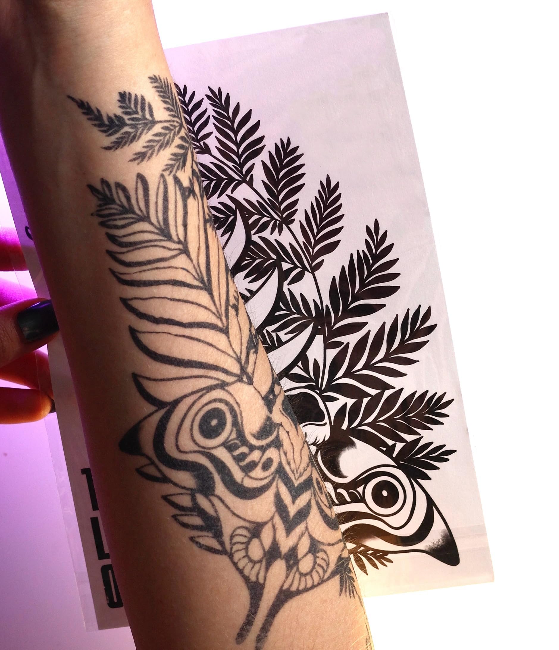BeautyMehndi Ellie tattoo renders realistic blue ink on arms, neck, hands.
