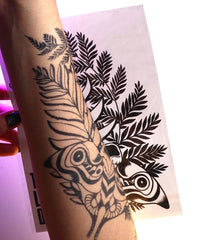 BeautyMehndi Ellie tattoo renders realistic blue ink on arms, neck, hands.