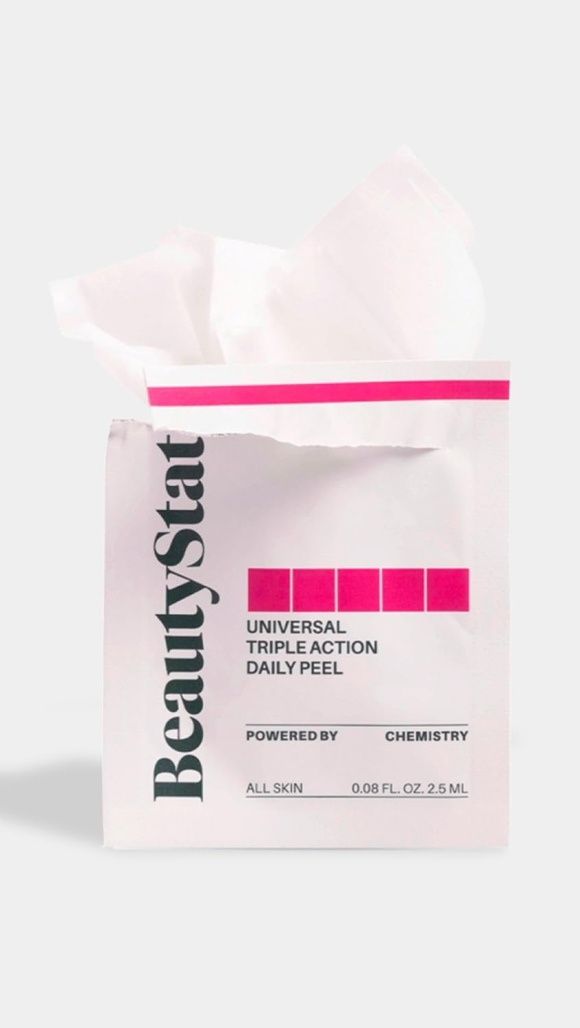 Hands applying BeautyStat peel pad to the face during skincare routine