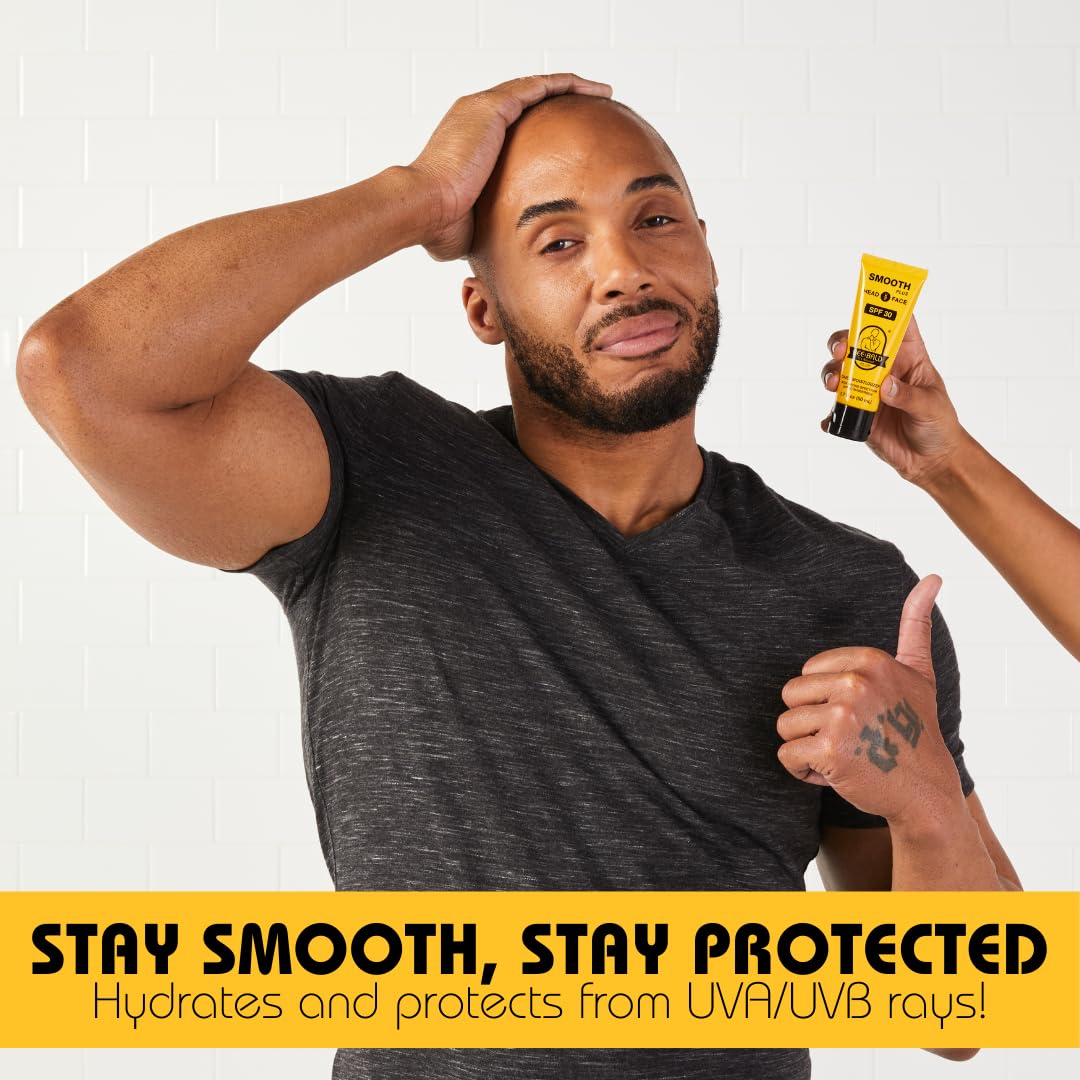 Hands applying moisturizer on shaved head for refreshed look.