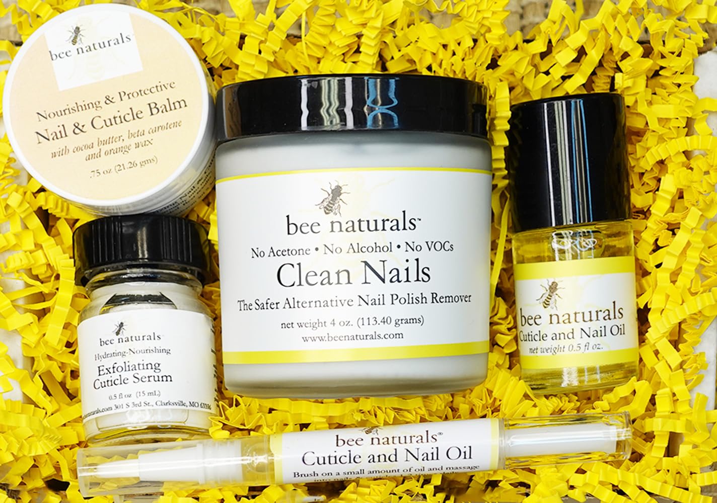 Bee Naturals cuticle oil bottle closeup highlighting Vitamin E nourishment for nails.