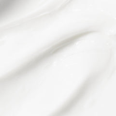 Beekman 1802 Coconut Cream Goat Milk Lotion jar shows creamy texture and tropical scent.