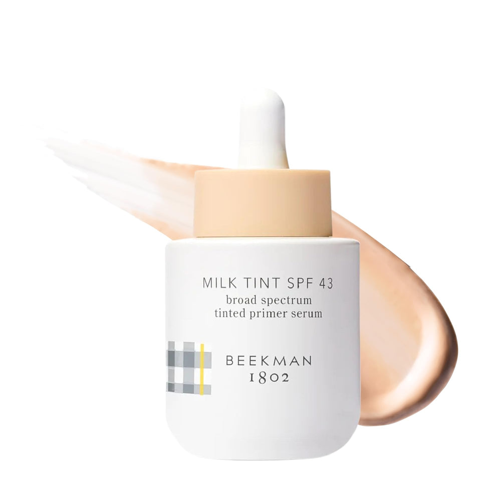 Beekman 1802 Milk Tint Primer Light bottle shows SPF 43 protection for radiant, protected skin.