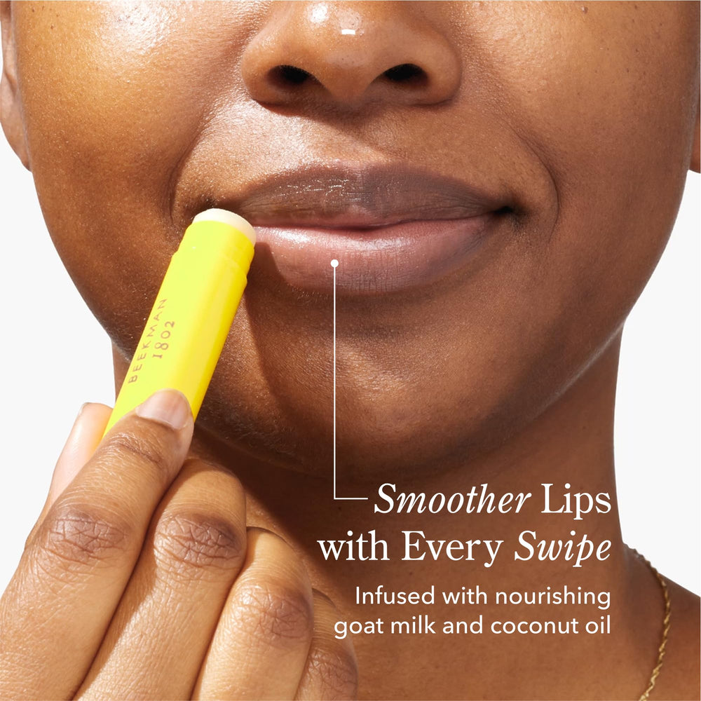 Beekman 1802 goat milk lip balm on lips providing instant moisture