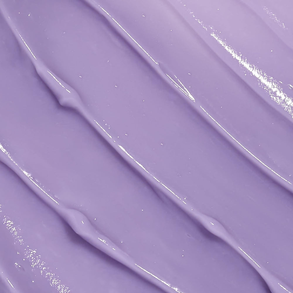 Beekman 1802 Midnight Milk application close-up showing smooth texture for gentle use.