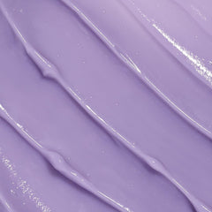 Beekman 1802 Midnight Milk application close-up showing smooth texture for gentle use.