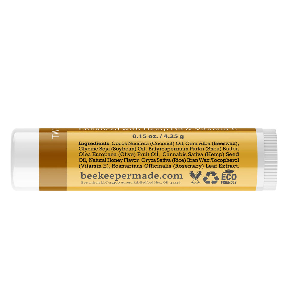 Beessential beeswax lip balm tubes on display show honey flavor and smooth application.