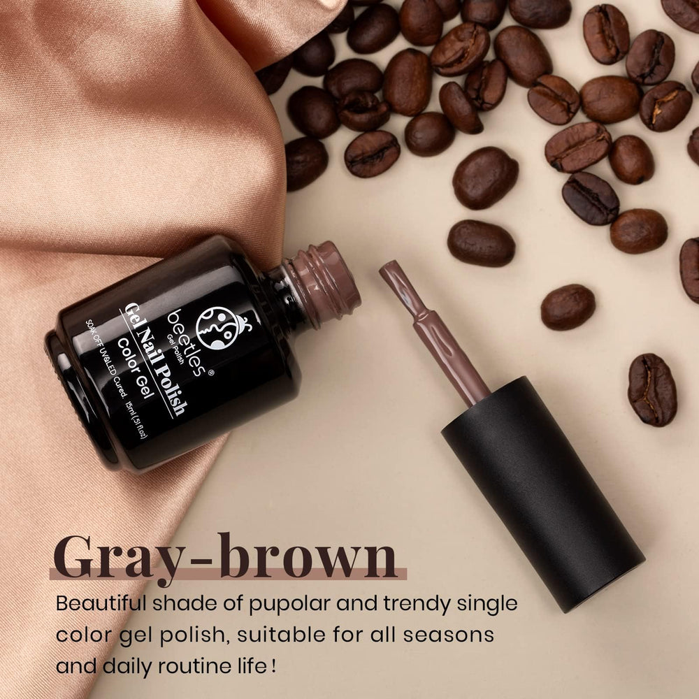 Beetles Brown Gel Polish brush applying even color for smooth manicure.