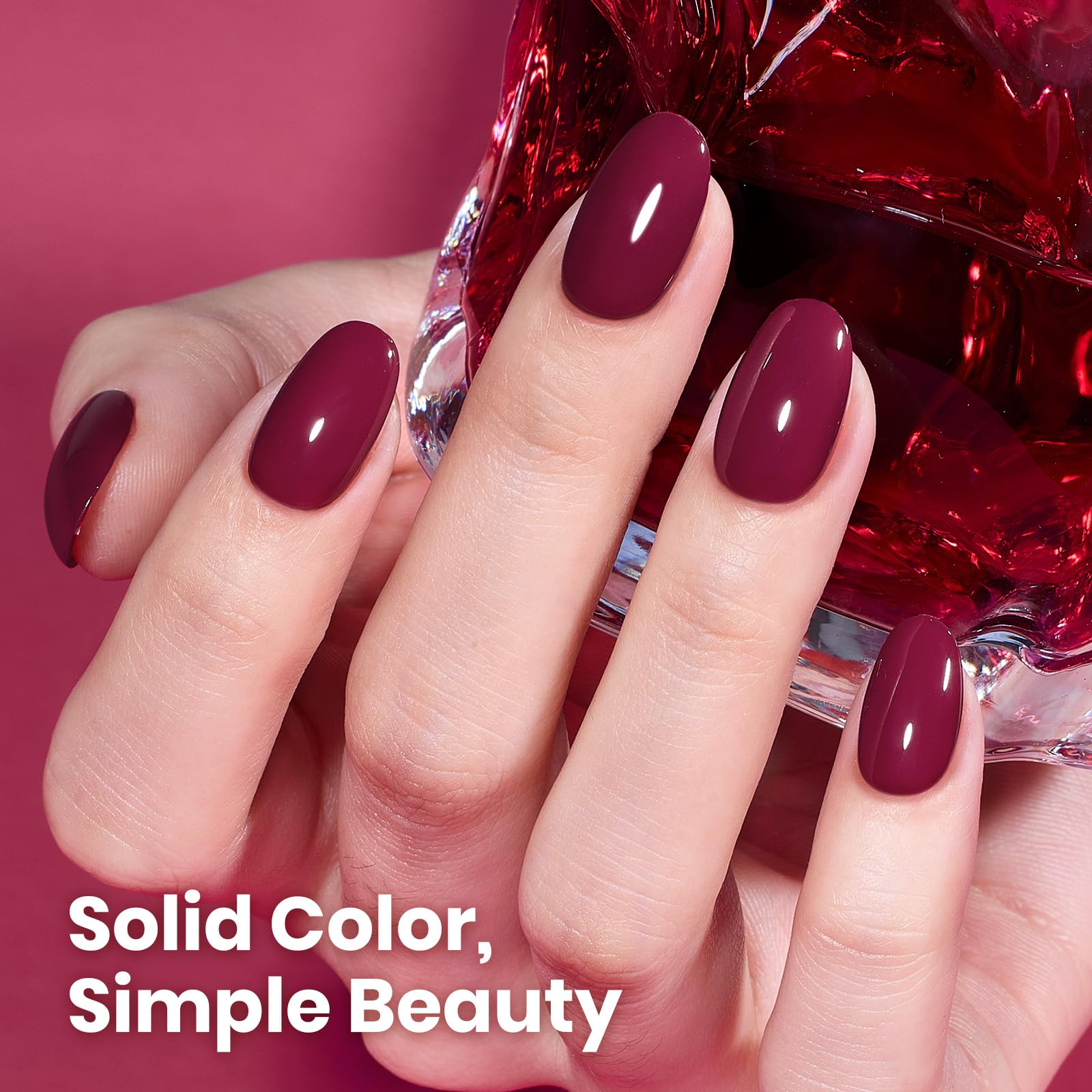 Beetles Burgundy Red gel polish applied on nail for glossy manicure