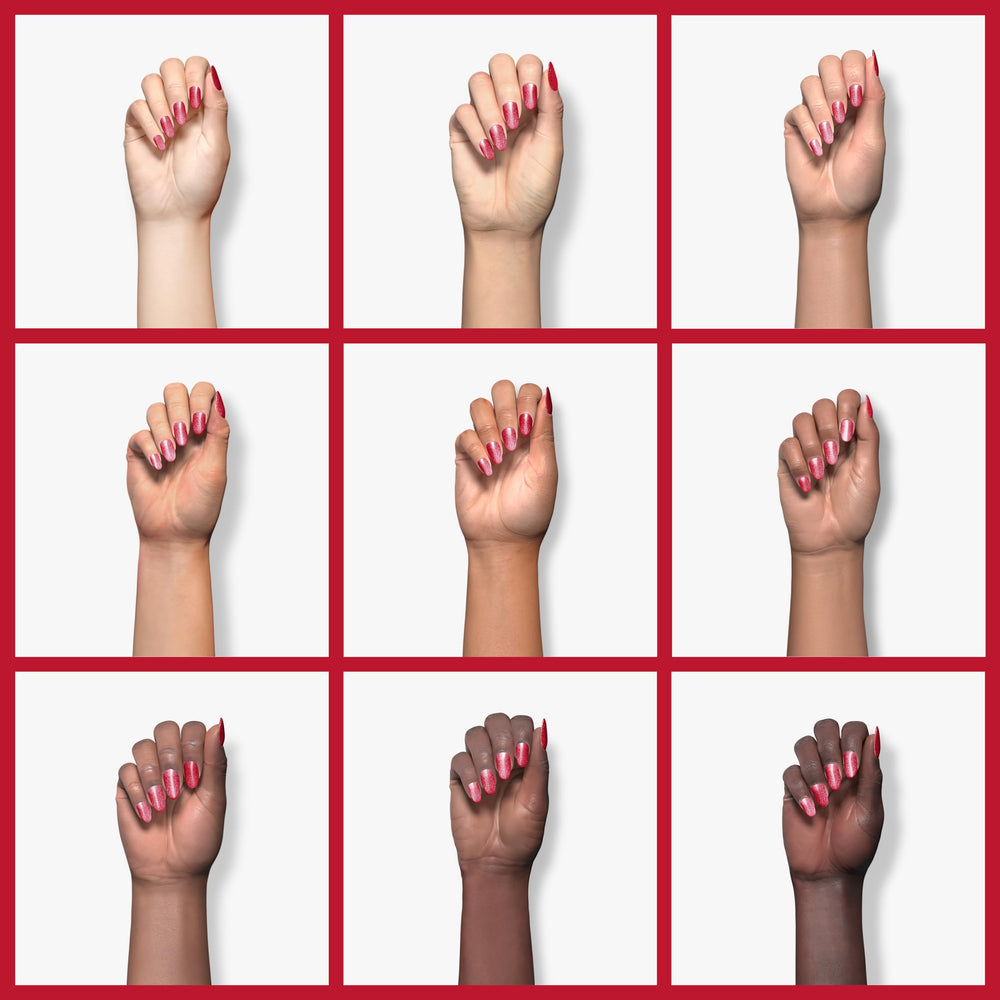 Beetles Glitter Red Gel Polish being cured under LED light for quick manicures