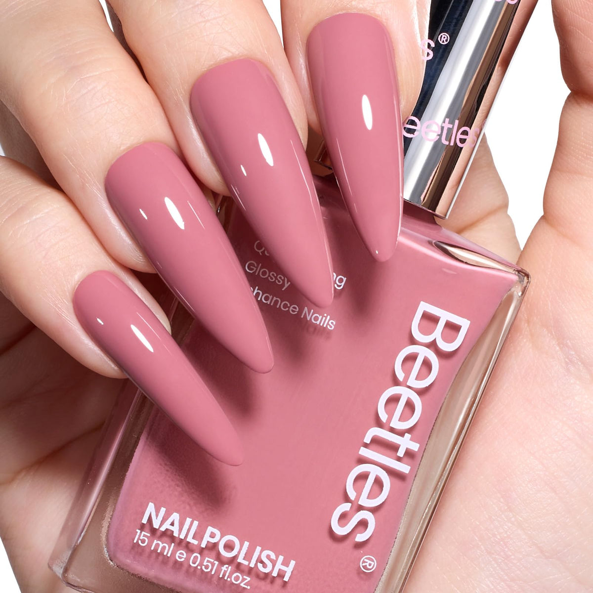 Beetles Pink Nail Polish bottle closeup shows dusty rose shade and glossy finish