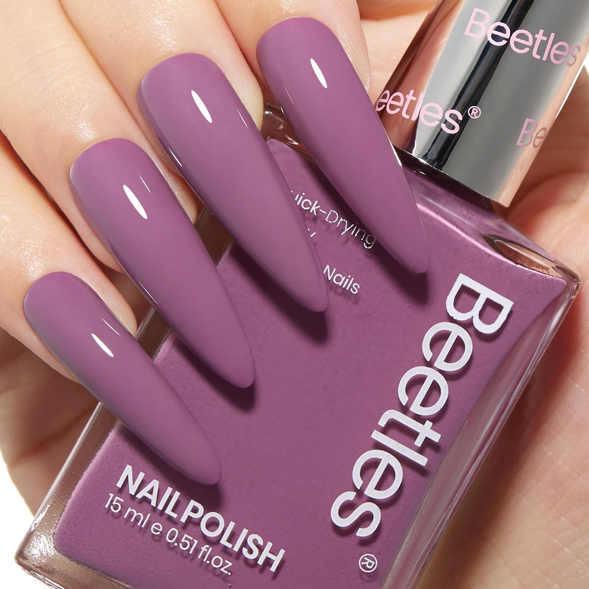 Beetles purple nail polish bottle with quick-dry long-lasting color.