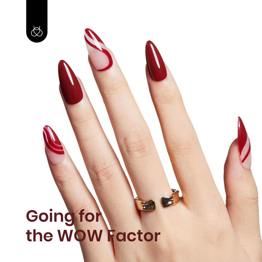Beetles Red Gel Polish nails displaying a sophisticated burgundy manicure.