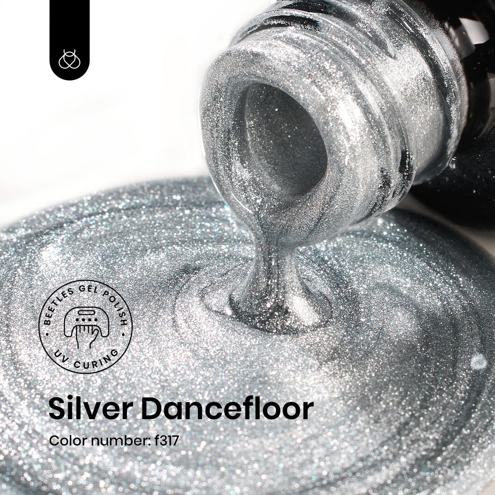 Beetles Silver Gel Polish glitter close-up highlights sparkle for festive looks.
