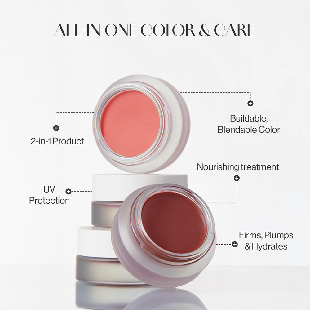 BEIGIC lip and cheek balm on lips for peach-coral glow.