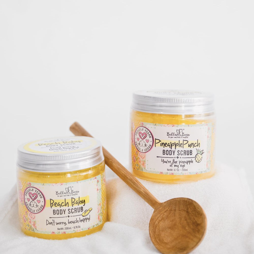 Bella & Bear pineapple scrub scent bottle emphasizes bright pineapple aroma.