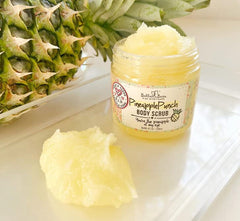 Bella & Bear pineapple scrub jar closeup highlights natural ingredients and creamy texture.