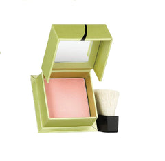 Benefit Dandelion powder compact open reveals a soft pink radiance for a subtle glow.