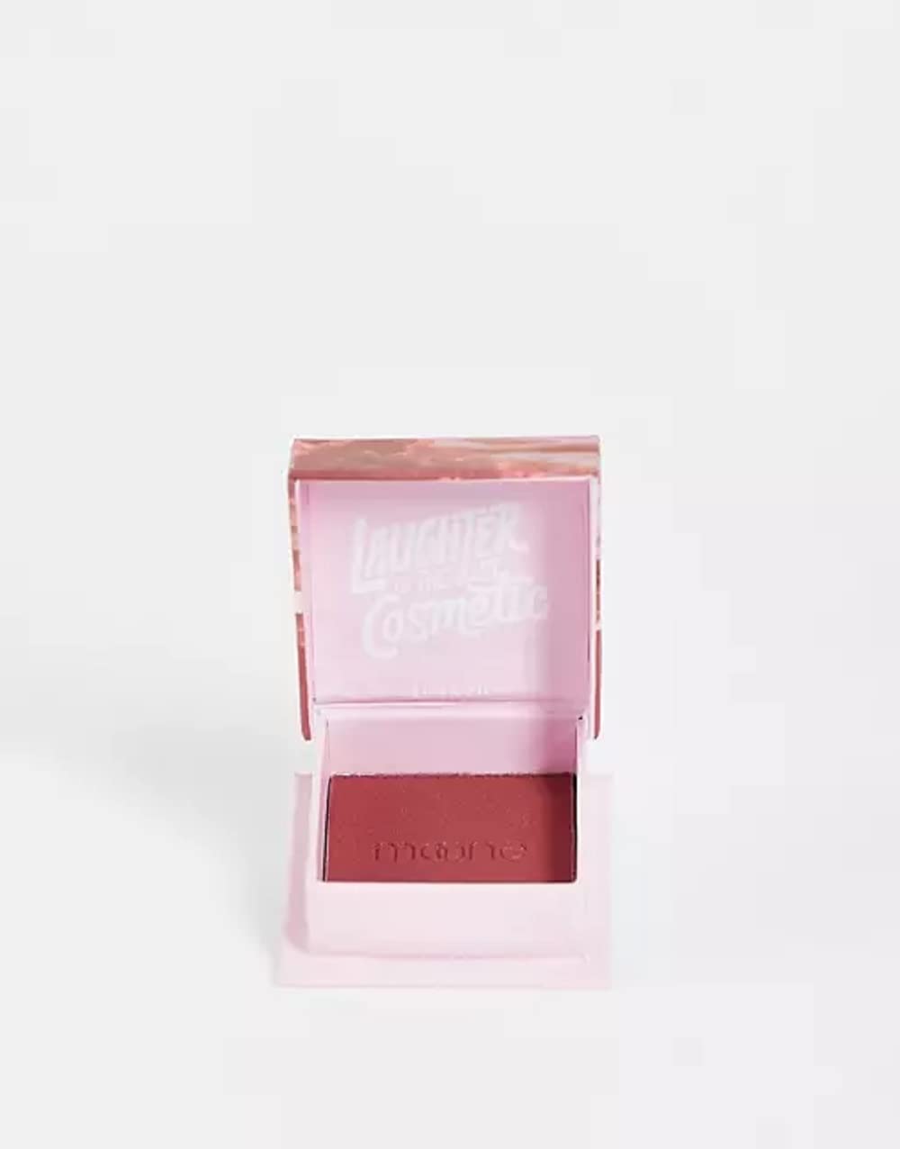Blush applied to cheek for natural berry glow.