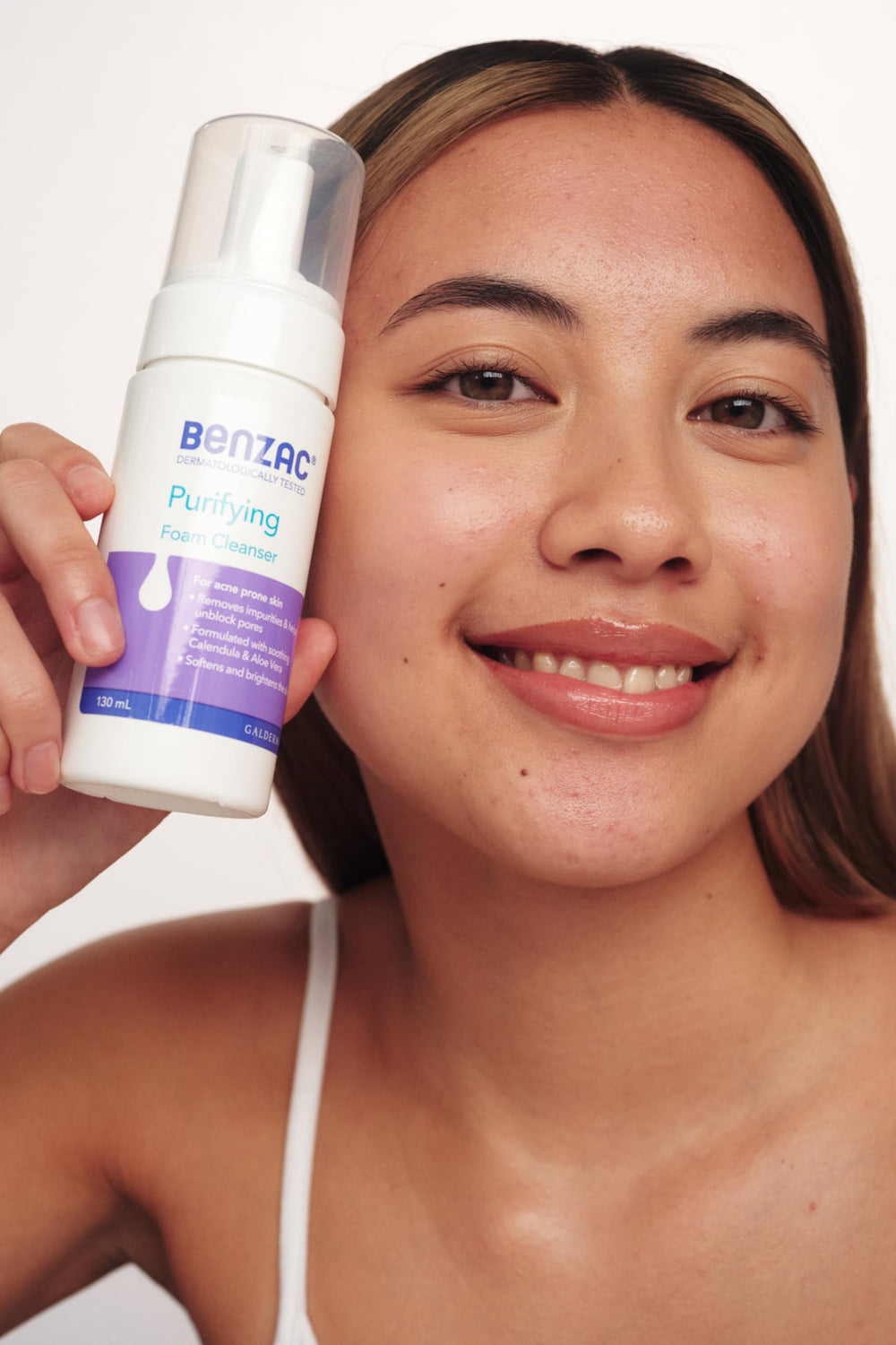 Benzac Daily Facial Foam Cleanser packaging on bathroom shelf