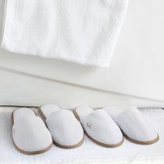 BERGMAN KELLY gray-textured spa slippers add modern style and comfort for guests