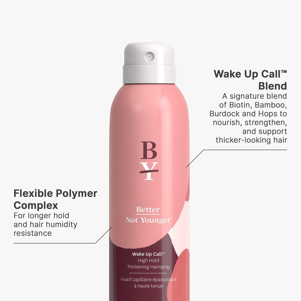 Hands applying Better Not Younger Wake Up Call Memory Mousse for even distribution