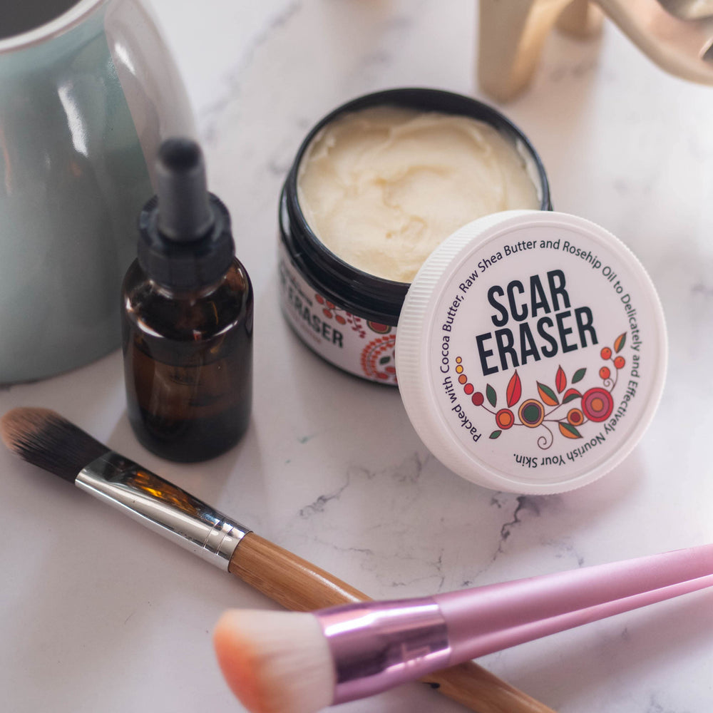 Better Shea Butter Scar Eraser Balm brush application on skin demonstration.