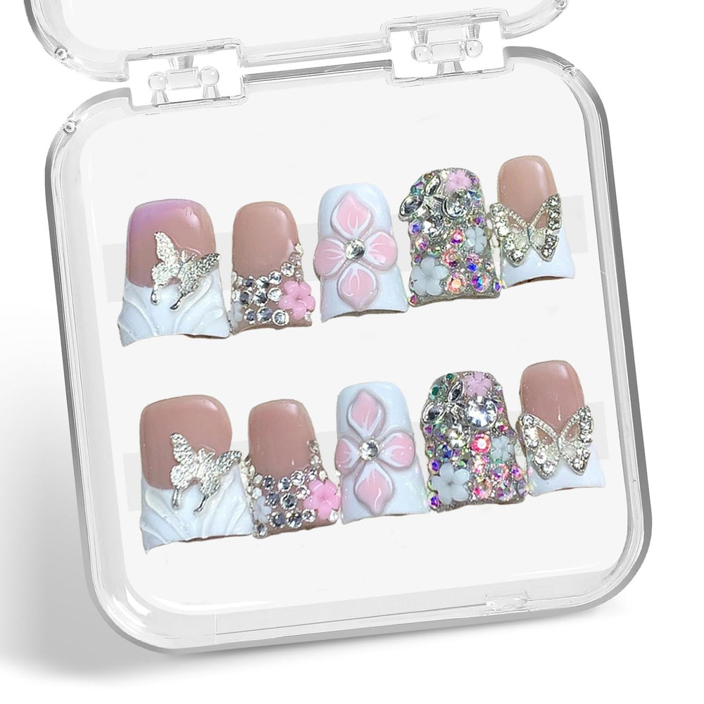 BHOOKA nails feature butterfly embossing for a delicate, eye-catching manicure.