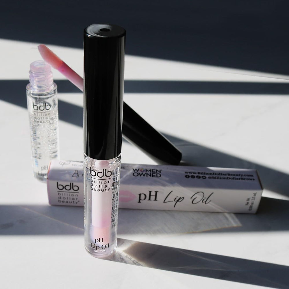Vegan and cruelty-free badge on lip oil packaging signaling ethical beauty.