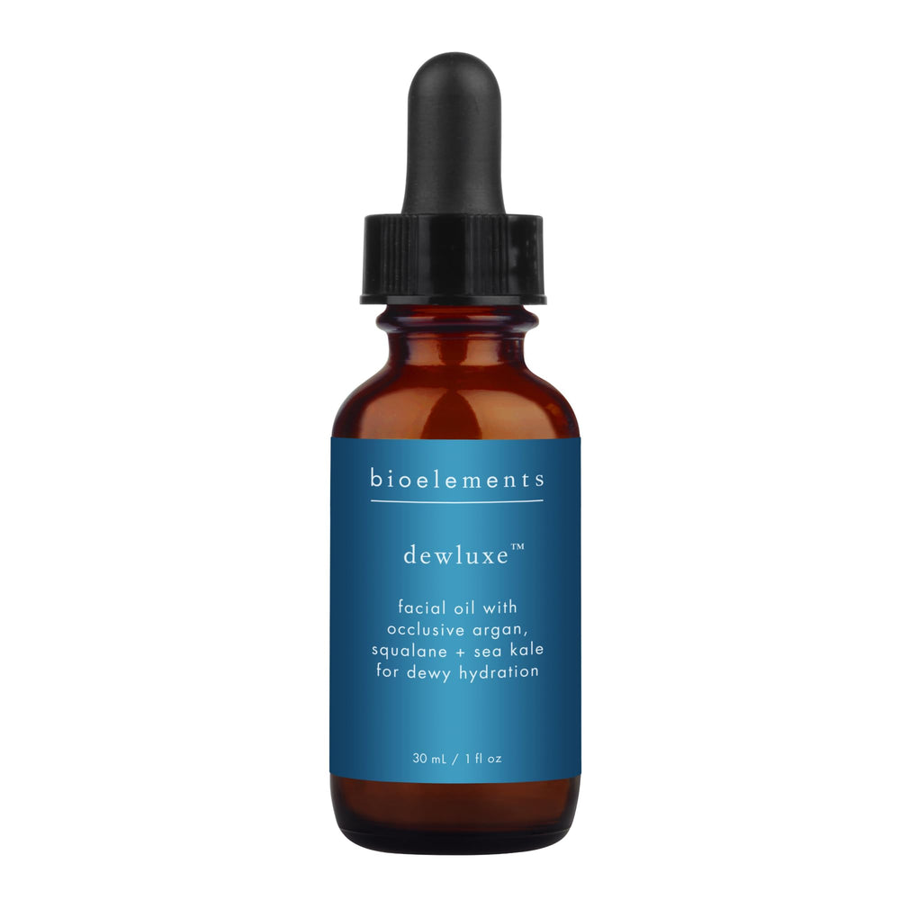 Bioelements Dewluxe bottle close-up showing premium, lightweight facial oil.