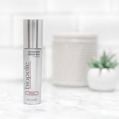 Biopelle Retriderm serum drops on hand showing application texture.