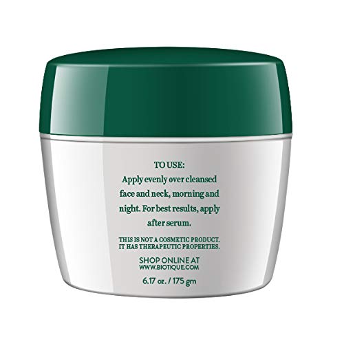 Biotique saffron youth cream texture on fingertips demonstrating smooth application.