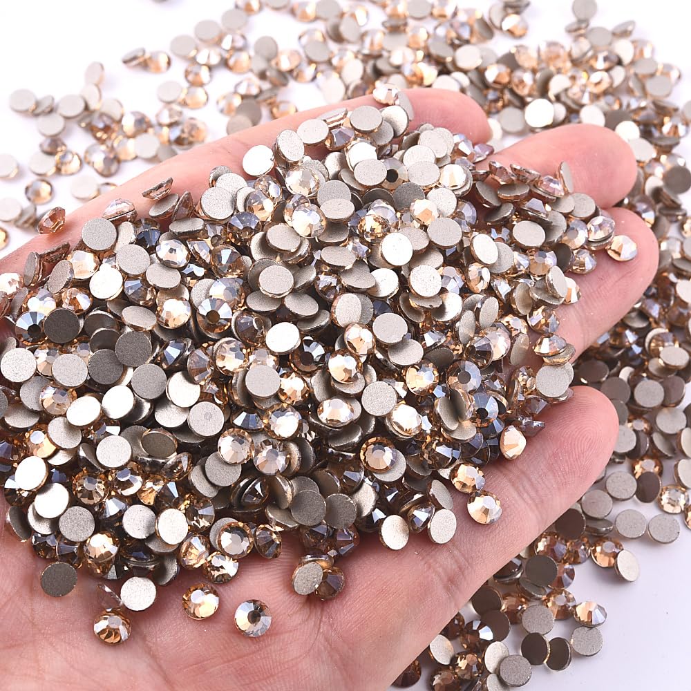 Blinginbox golden champagne rhinestones in bulk packaging to inspire DIY projects.