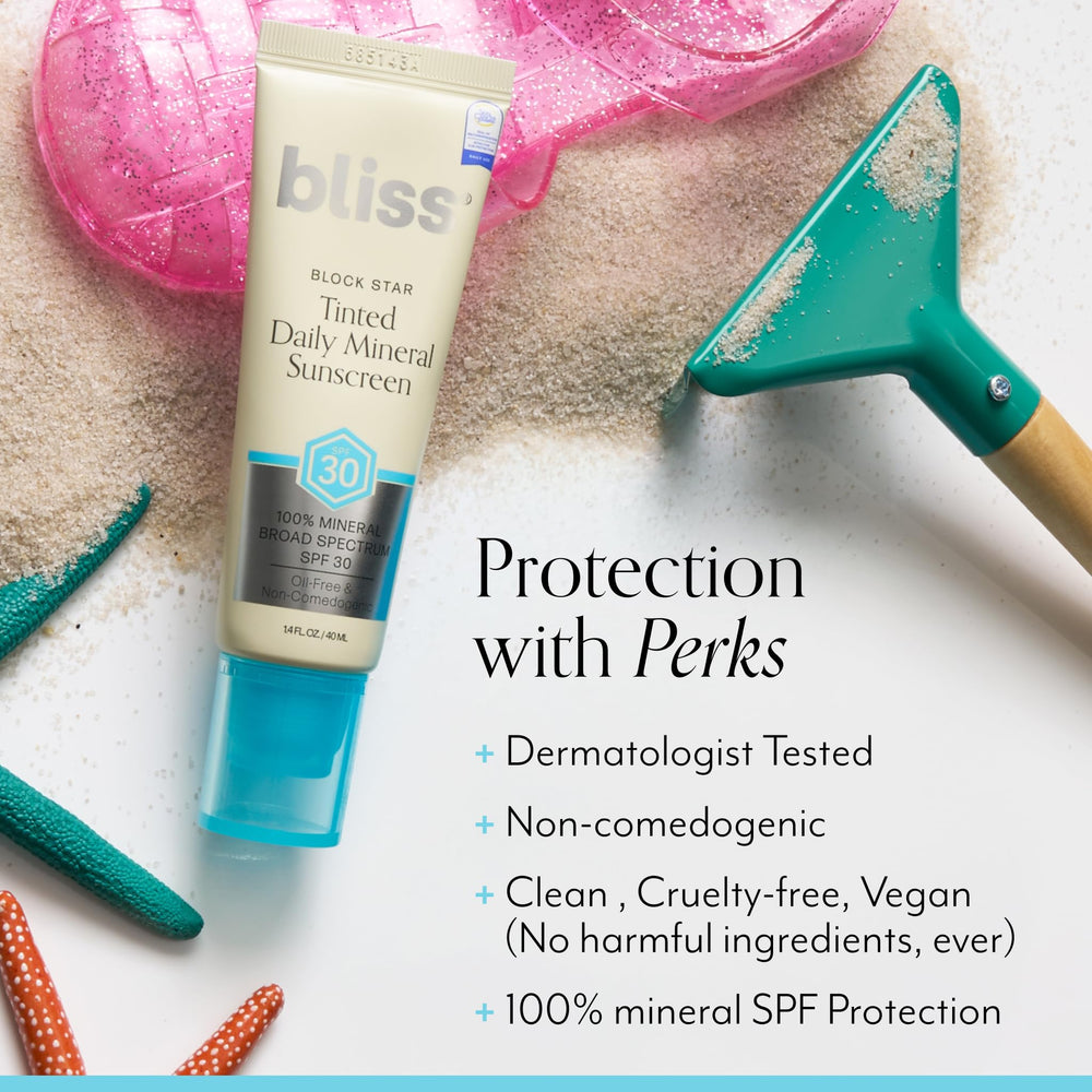 Bliss Block Star cream texture shown on fingertip.