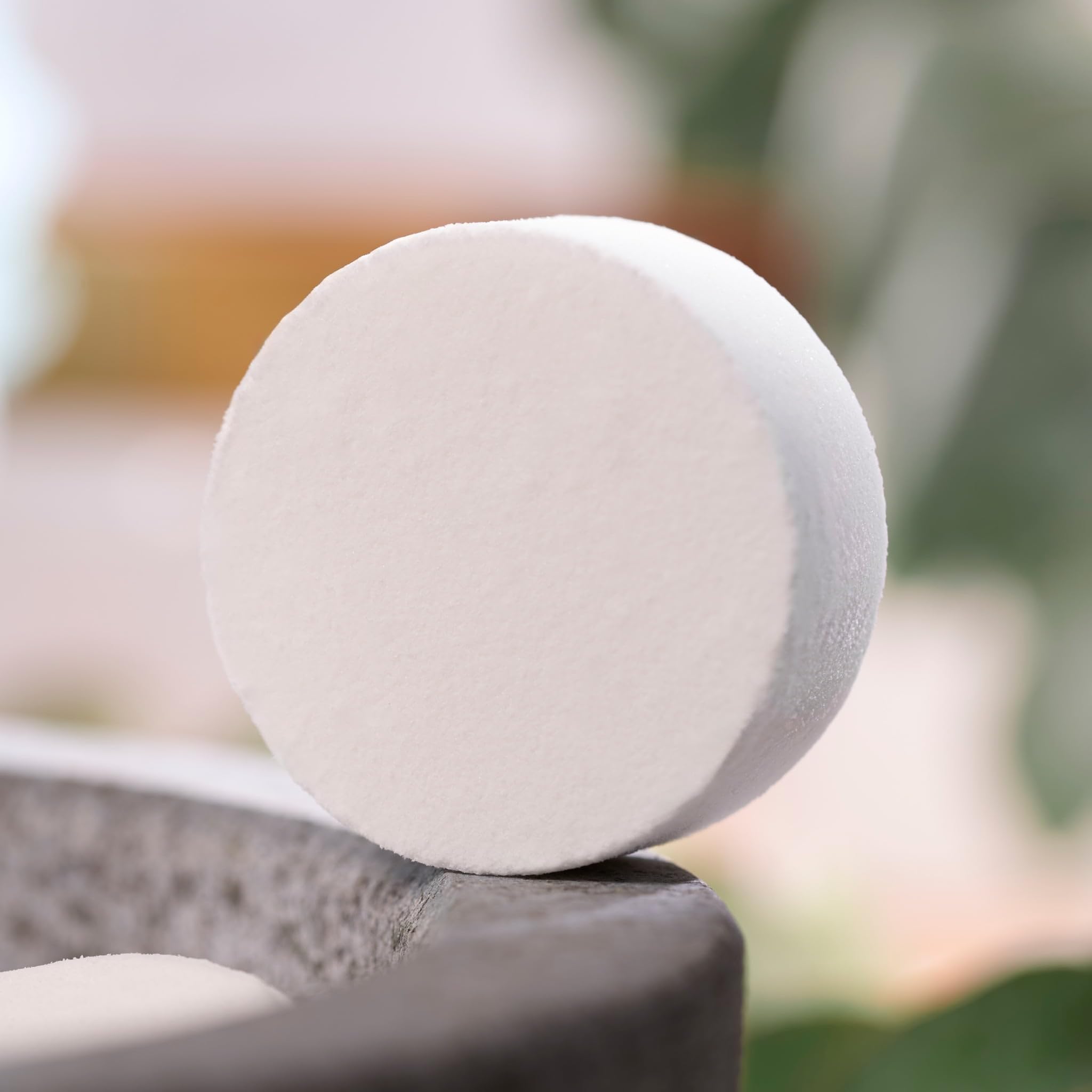 Bliss Eucalyptus shower steamers pack displayed on countertop highlighting all-natural ingredients.