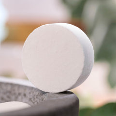 Bliss Eucalyptus shower steamers pack displayed on countertop highlighting all-natural ingredients.