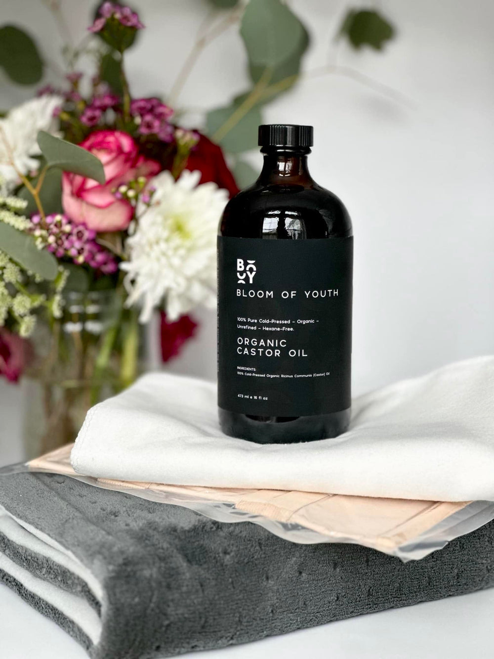 Bloom of Youth castor oil for hair, lashes, and eyebrow care.