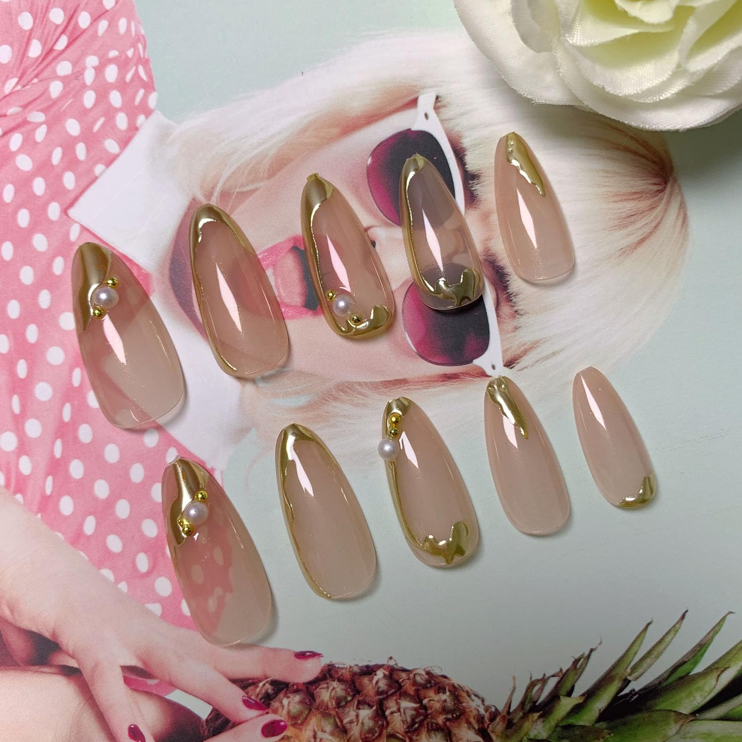 Blruyci gold French nails with 3D lines and pearl accents.
