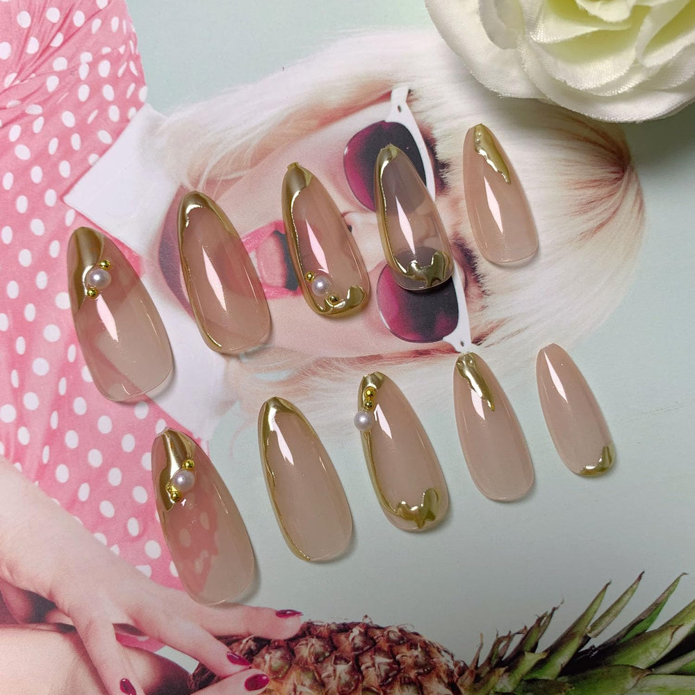 Blruyci gold French nails with 3D lines and pearl accents.