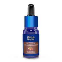 Blue Nectar Nabhi Oil bottle pour showing smooth texture and natural ingredients for daily digestive support.
